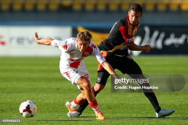 Stefan Mauk of the Heart and Vince Lia of the Phoenix compete for the ball during the round 19 A-League match between Wellington Phoenix and...