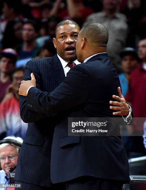 Head Coaches Doc Rivers of the Los Angeles Clippers and Melvin Hunt of the Denver Nuggets embrace at the end of the game after a 110-103 Clipper win...