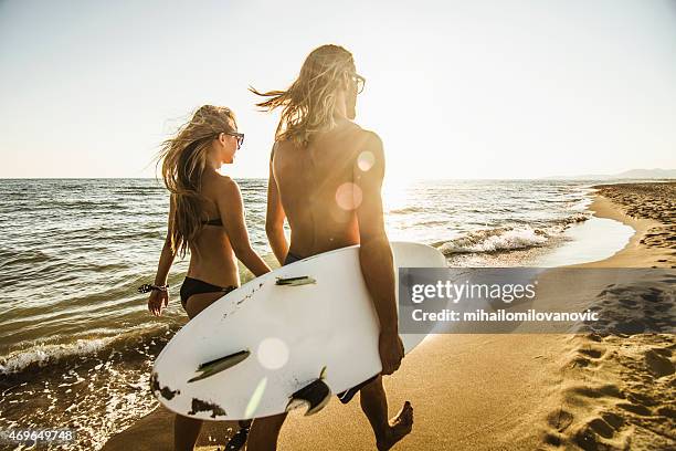 walking on the beach - air date stock pictures, royalty-free photos & images