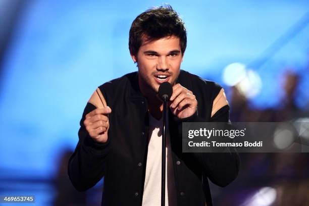 Actor Taylor Lautner speaks onstage during the 4th Annual Cartoon Network Hall Of Game Awards held at the Barker Hangar on February 15, 2014 in Santa...
