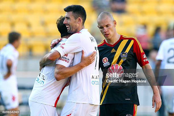 Jason Hoffman and Rob Wielaert of the Heart congratulate each other after the final whistle while Stein Huysegems of the Phoenix looks on during the...