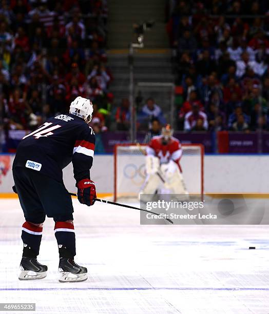 Oshie of the United States scores on a shootout against Sergei Bobrovski of Russia during the Men's Ice Hockey Preliminary Round Group A game on day...