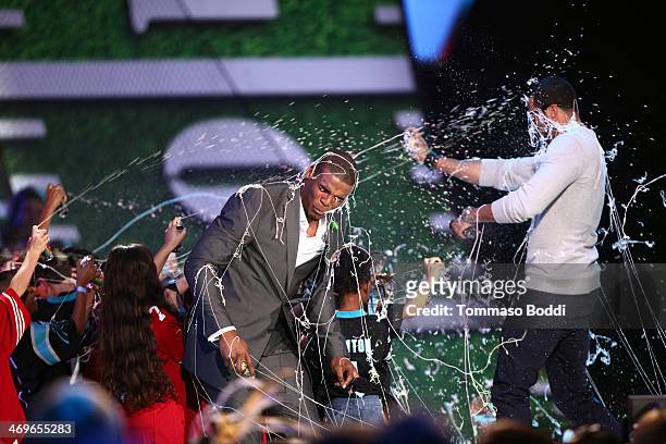 Co-hosts Cam Newton and Colin Kaepernick onstage during the 4th Annual Cartoon Network Hall Of Game Awards held at the Barker Hangar on February 15,...