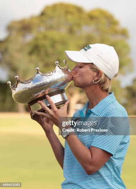 Karrie Webb of Australia kisses the winners trophy after winning the tournament of the ISPS Handa Women's Australian Open at The Victoria Golf Club...