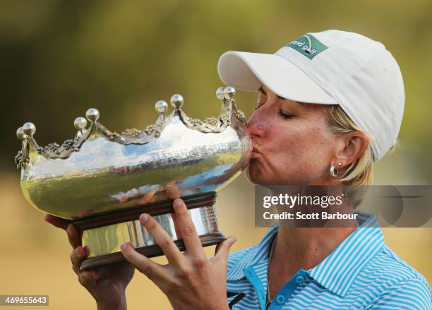 Karrie Webb of Australia kisses the trophy after winning the tournament during the fourth round of the ISPS Handa Women's Australian Open at The...