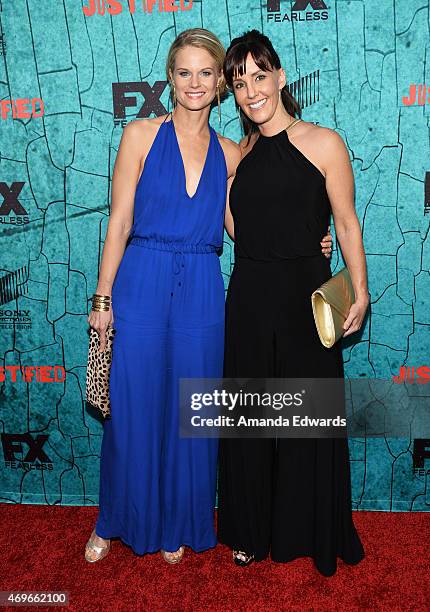 Actress Joelle Carter and producer Ingrid Escajeda arrive at FX's "Justified" series finale premiere at the Montalban Theater on April 13, 2015 in...
