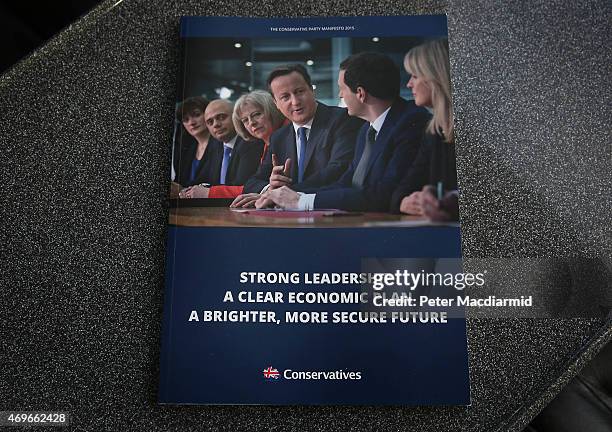 Copy of the newly released Conservative party election manifesto is shown to reporters on April 14, 2015 in London, England. As the general election...