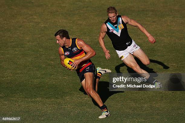 Brodie Smith of the Crows runs away with the ball during the round two AFL NAB Challenge Cup match between the Adelaide Crows and the Port Adelaide...