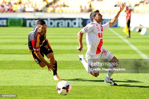 Aziz Behich of the Heart goes down after a challenge from Michael Boxall of the Phoenix during the round 19 A-League match between Wellington Phoenix...