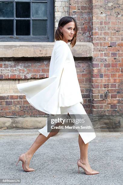 Beauty Editor Eleanor Pendleton wears an Ellery dress, Christian Louboutin shoes and a Daily Edited clutch at Mercedes-Benz Fashion Week Australia...