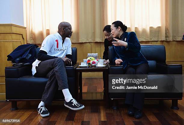 Zhao Wen , Vice Mayor of Shanghai talks with Laureus Chairman Edwin Moses during the Laureus Shanghai Football Campus Tour prior to the Laureus World...