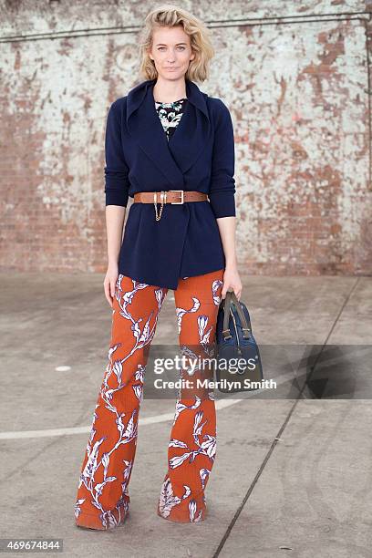 Fashion Blogger Zanita wears a Tome shirt, Oroton cardigan, Karen Walker belt and trousers and a Benah for Karen Walker bag at Mercedes-Benz Fashion...