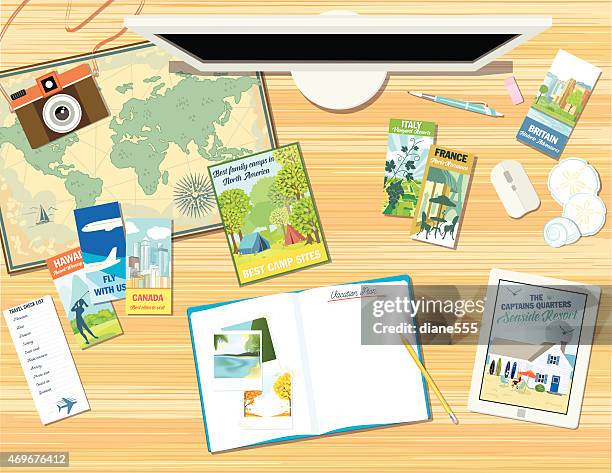 desk with objects for planning a vacation or travel - notepad stock illustrations stock illustrations