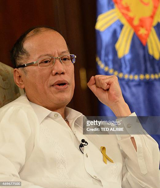 Philippine President Benigno Aquino gestures as he answers a question during an interview with AFP at Malacanang Palace in Manila on April 14, 2015....