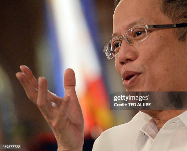 Philippine President Benigno Aquino gestures as he answers a question during an interview with AFP at Malacanang Palace in Manila on April 14, 2015....