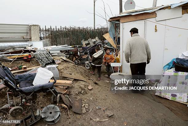 Photo taken on January 31, 2014 shows people at a camp in Villeneuve-Saint-Georges, in the southeastern suburbs of Paris, which benefits from the...