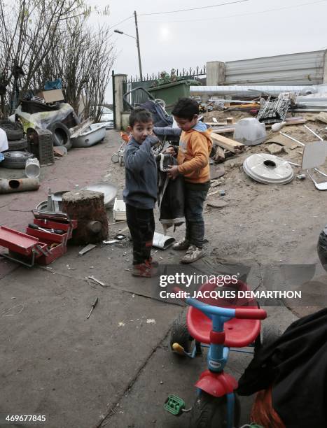 Photo taken on January 31, 2014 shows Roma children at a camp in Villeneuve-Saint-Georges, in the southeastern suburbs of Paris, which benefits from...