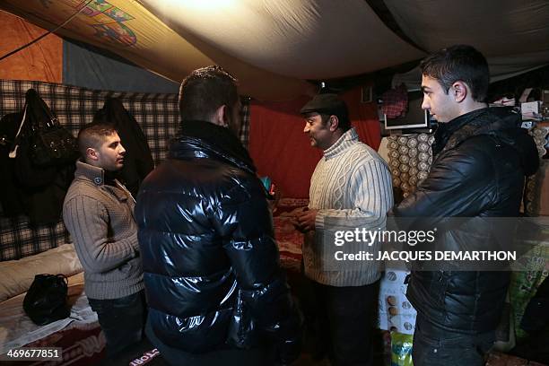 Photo taken on January 31, 2014 shows Roma youths engaged in civic service at a Roma camp in Villeneuve-Saint-Georges, in the southeastern suburbs of...