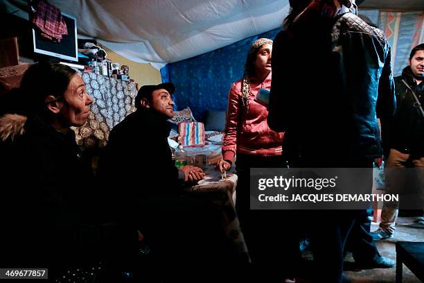 Photo taken on January 31, 2014 shows Roma youths engaged in civic service at a Roma camp in Villeneuve-Saint-Georges, in the southeastern suburbs of...