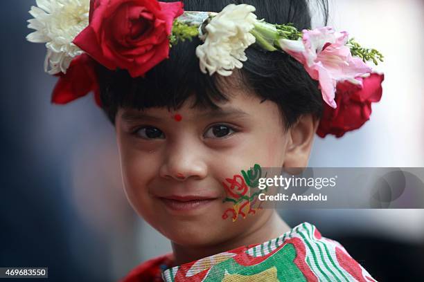 Bangladeshi people participate in a rally to celebrate the first day of the Bengali New Year or Pohela Boishakh in Dhaka, Bangladesh on April 14,...