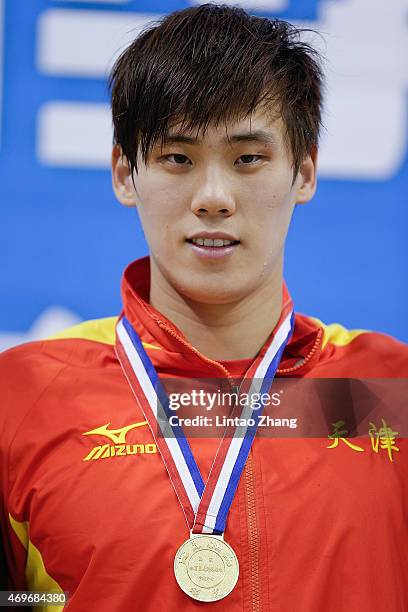 Li Xiang of China celebrates on the podium after the Men's 200 meters breaststroke final on day six of the China National Swimming Championships on...
