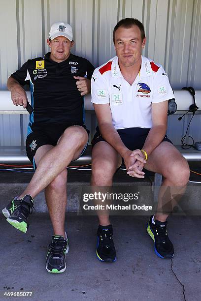 Former Geelong teamates Garry Hocking of the Power and Darren Milburn of the Crows catch up before the round two AFL NAB Challenge Cup match between...