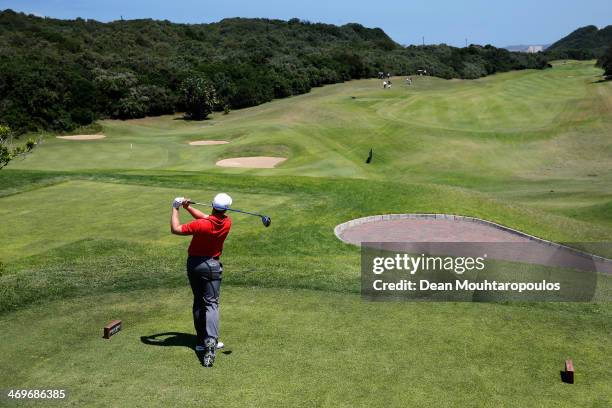 Oliver Fisher of England hits his tee shot on the 3rd hole during the Final Round of the Africa Open at East London Golf Club on February 16, 2014 in...