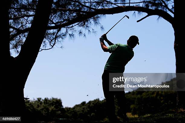 Thomas Aiken of South Africa hits his second shot on the 1st hole during Final Day of the Africa Open at East London Golf Club on February 16, 2014...