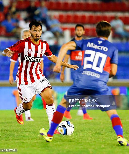 Juan Sanchez Miño of Estudiantes fights for the ball with Facundo Sanchez of Tigres during a match between Tigre and Estudiantes as part of 10th...