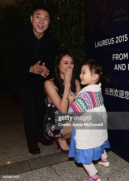 Laureus World Sports Academy member Li Xiaopeng with wife Angel and daughter Olivia arrive for the Laureus World Sports Awards 2015 Welcome Party at...