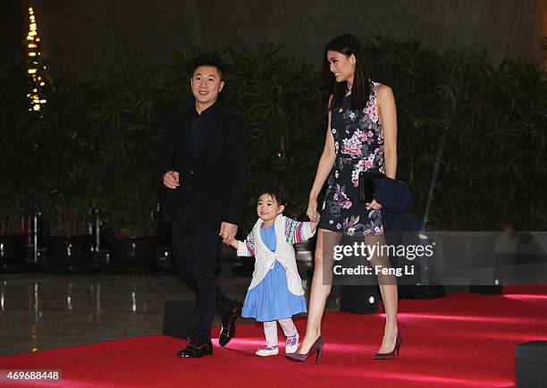 Laureus World Sports Academy member Li Xiaopeng with wife Angel and daughter Olivia arrive for the Laureus World Sports Awards 2015 Welcome Party at...