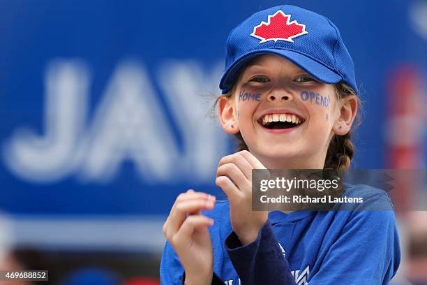 Bella Wood 10, has a laugh as she plays catch with her brothers outside of the Rogers Centre prior to the start of the game. The Toronto Blue Jays...