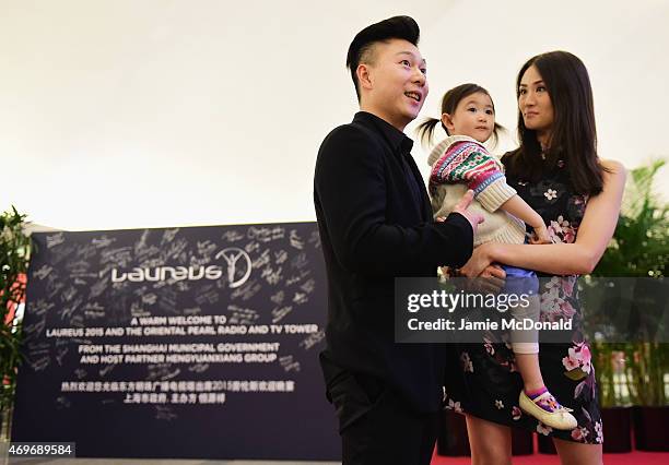 Laureus World Sports Academy member Li Xiaopeng with wife Angel and daughter Olivia arrive for the Laureus World Sports Awards 2015 Welcome Party at...
