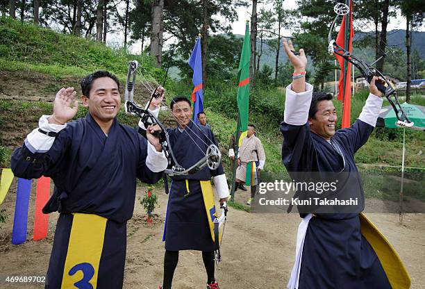 Competitors dance to celebrate as their teammate hit the target during the17th Yangphel Open Archery Tournament Final in Thimphu, Bhutan on August...