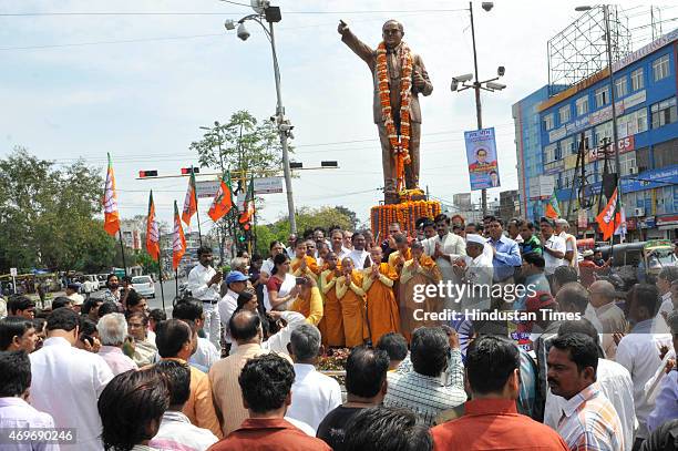 Followers along with members of various parties like BJP and AAP paying tribute to Dr BR Ambedkar on his birth anniversary on April 14, 2015 in...