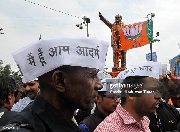 Followers along with members of various parties like BJP and AAP paying tribute to Dr BR Ambedkar on his birth anniversary on April 14, 2015 in...