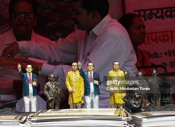 People purchasing portrait and statues of Dr BR Ambedkar after paying tributes on his birth anniversary at Parliament Street on April 14, 2015 in New...