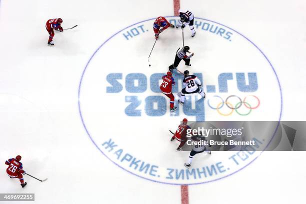 Pavel Datsyuk of Russia faces off against Michal Handzus of Slovakia to start the Men's Ice Hockey Preliminary Round Group A game on day nine of the...
