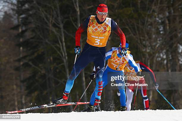 Alexander Legkov of Russia competes on the third leg of the Cross Country Men's 4 x 10 km Relay during day nine of the Sochi 2014 Winter Olympics at...