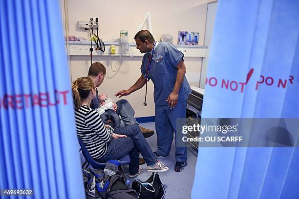 Doctor attends to a young patient in the specialist Children's Accident and Emergency department of the 'Royal Albert Edward Infirmary' in Wigan,...