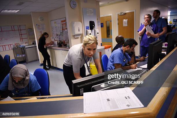 Members of clinical staff work at computers in the Accident and Emergency department of the 'Royal Albert Edward Infirmary' in Wigan, north west...