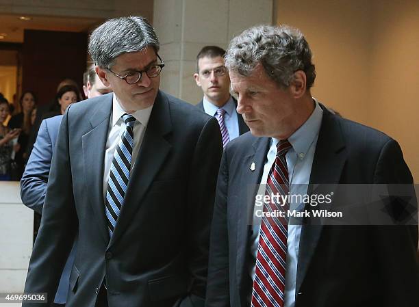 Treasury Secretery Jack Lew walks with Sen Sherrod Brown as they walk to a meeting on Capitol Hill, April 14, 2015 in Washington, DC. Secretary Lew...