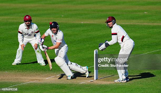 Durham batsman Scott Borthwick cuts a ball towards the boundary watched by keeper Alex Barrow and fielder Johann Myburgh during day three of the LV...