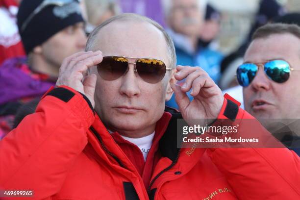Russian President Vladimir Putin watches the men's 4x10 K cross-country relay at the 2014 Winter Olympics, on February 16, 2014 in Krasnaya Polyana,...
