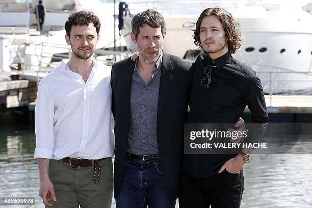 English actor Georges Blagden, French director Jalil Lespert and Welsh actor Alexander Vlahos pose during a photocall for the series "Versailles"...