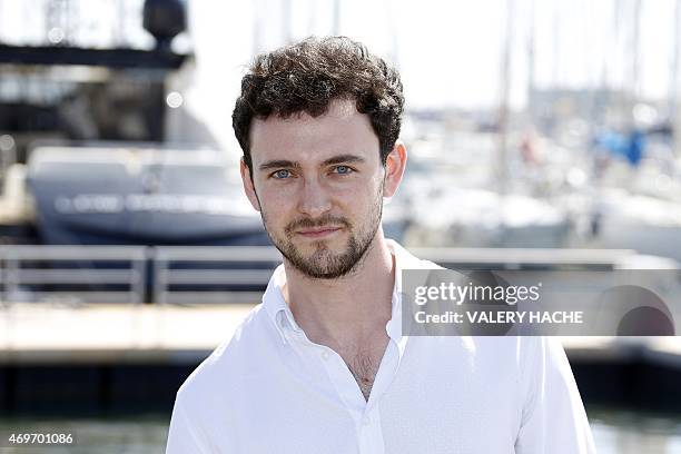 English actor Georges Blagden poses for a photocall for the serie "Versailles" during the MIPTV , on April 14, 2015 in Cannes, on the French Riviera....