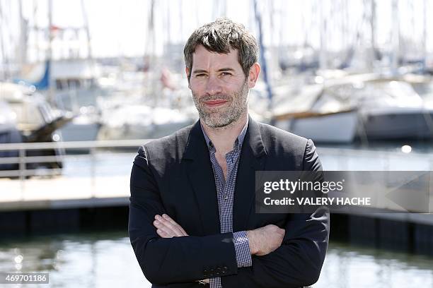 French director Jalil Lespert poses for a photocall for the serie "Versailles" during the MIPTV , on April 14, 2015 in Cannes, on the French Riviera....