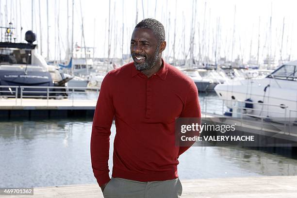 British actor Idris Elba poses during a photocall for the series "Mandela, my dad and me" during the MIPTV , in Cannes, on the French Riviera, on...