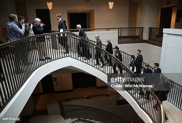 Secretary of State John Kerry is trailed by staff and security while departing a meeting with members of the U.S Senate on the proposed deal with...
