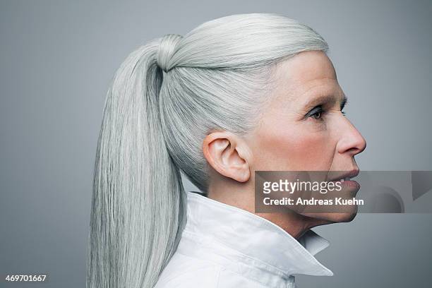 profile of mature woman with grey hair, portrait. - hair style stock-fotos und bilder
